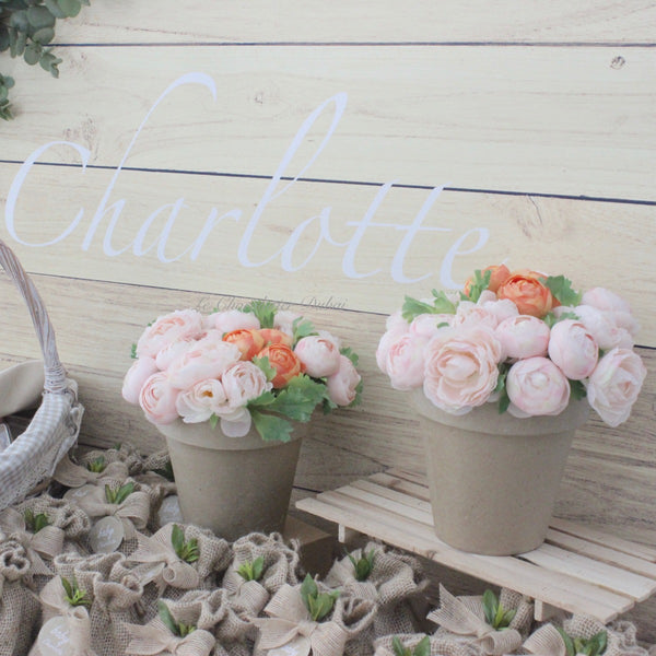 Baby girl rustic floral chocolate wood stand with personalized backdrop.