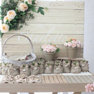 Baby girl rustic floral chocolate wood stand with personalized backdrop.