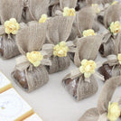 Flower & jute ribbon decorated loose chocolate