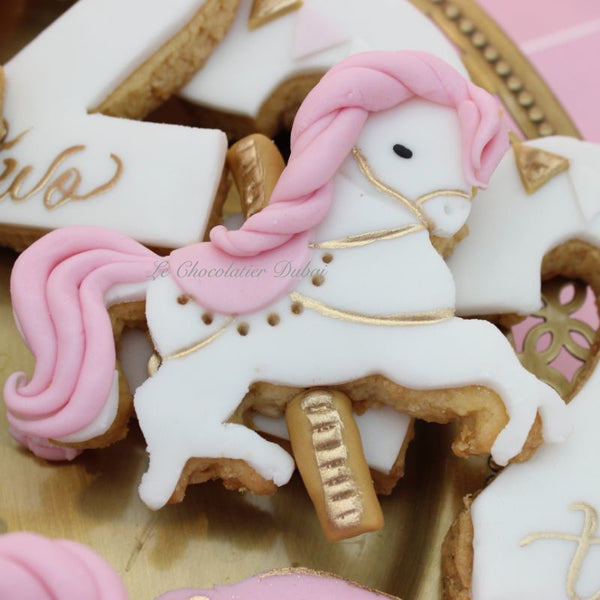 Baby girl carousel theme dessert table