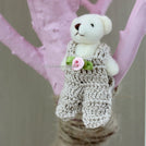 Baby rustic theme crochet decorated chocolate wood stand with customized backdrop.