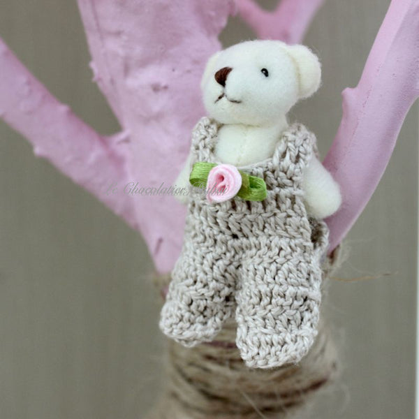 Baby rustic theme crochet decorated chocolate wood stand with customized backdrop.