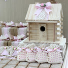 Baby rustic theme crochet decorated chocolate wood stand with customized backdrop.