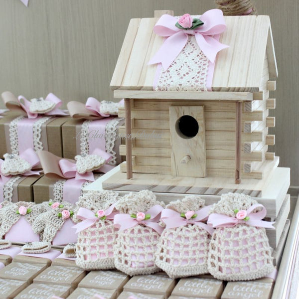 Baby rustic theme crochet decorated chocolate wood stand with customized backdrop.