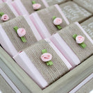 Baby rustic theme crochet decorated chocolate wood stand with customized backdrop.