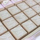 Baby rustic theme crochet decorated chocolate wood stand with customized backdrop.