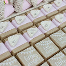 Baby rustic theme crochet decorated chocolate wood stand with customized backdrop.