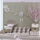 Baby rustic theme crochet decorated chocolate wood stand with customized backdrop.