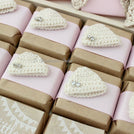 Baby rustic theme crochet decorated chocolate wood stand with customized backdrop.