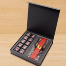 Corporate branded premium chocolate magnetic printed hard box with matching ribbon.