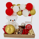 Valentine's decorated balloons, chocolate & sweets wooden tray